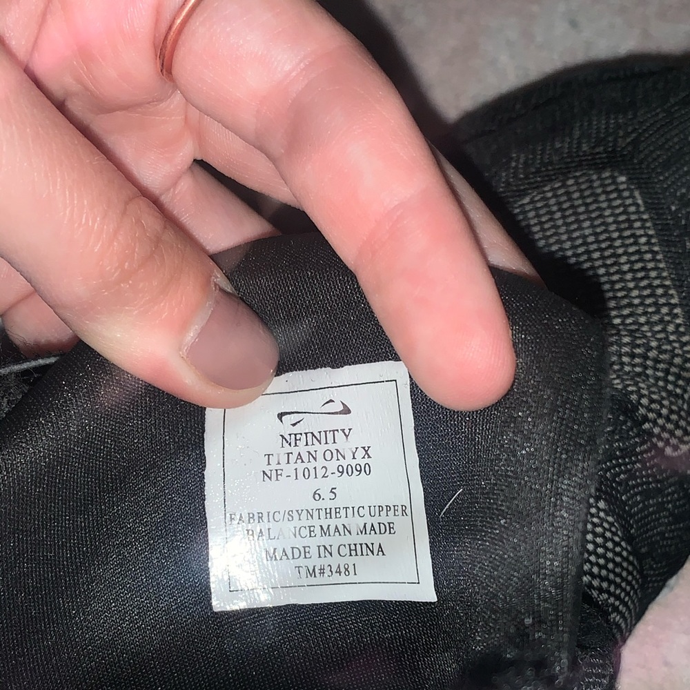 Pair of Black NFINITY cheer shoes size 6.5.